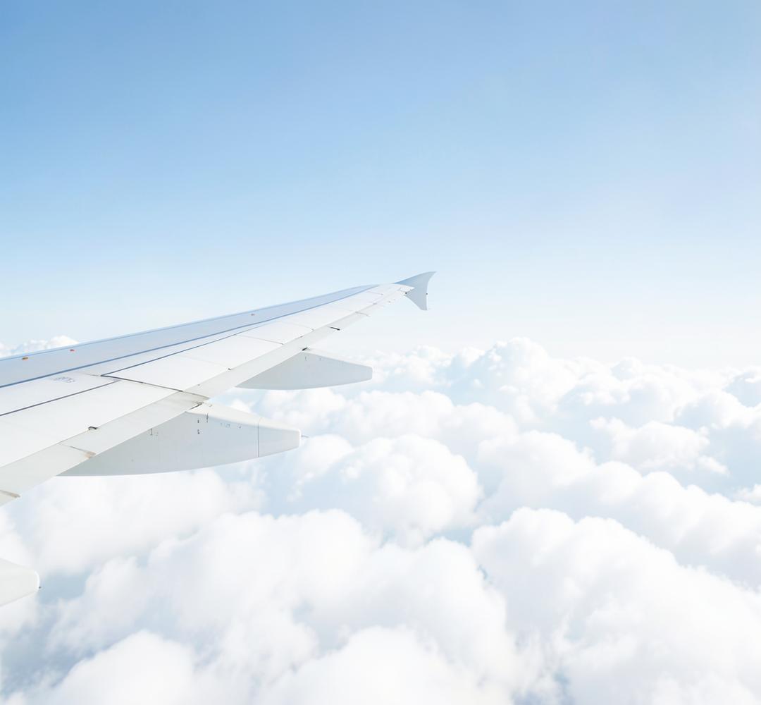 Airplane wing above the clouds